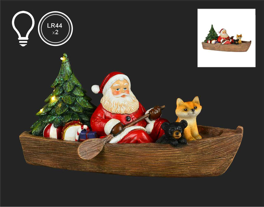 Santa in Canoe Statue